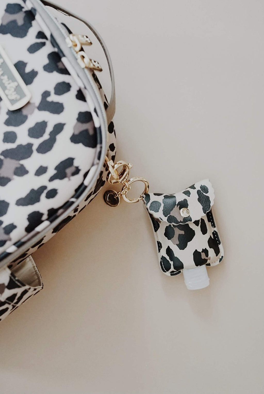Itzy Ritzy Hand Sanitizer Holder - Hand Sanitizer Case Keychain Fits 2-Ounce Bottles of Hand Sanitizer (Not Included) - Clips to
